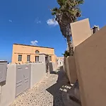 Вилла Oia's Heritage Captain Mansion Ия